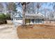Charming, light blue single-story home featuring a welcoming yellow front door and an attached garage at 4788 Porter Dr, North Charleston, SC 29420