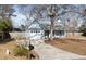 Blue home with yellow door and well-maintained lawn and driveway at 4788 Porter Dr, North Charleston, SC 29420