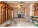 Spacious garage with shelving, ceiling fan, and water heater at 4788 Porter Dr, North Charleston, SC 29420