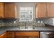 Kitchen sink with updated fixtures and tile backsplash, offering a functional workspace at 4788 Porter Dr, North Charleston, SC 29420