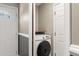 Bright laundry closet with gray walls and modern washing machine at 4788 Porter Dr, North Charleston, SC 29420