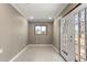Living room featuring neutral paint, tile floors, and a window view at 4788 Porter Dr, North Charleston, SC 29420