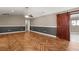 Spacious living room featuring herringbone wood floors and a large barn door at 4788 Porter Dr, North Charleston, SC 29420