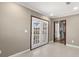 Bright living room features french doors and neutral color palette at 4788 Porter Dr, North Charleston, SC 29420