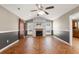 Spacious living room featuring a fireplace, fan, and herringbone wood flooring at 4788 Porter Dr, North Charleston, SC 29420