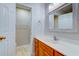 Bathroom featuring wood vanity, white countertop, square framed mirror and toilet at 546 Tayrn Dr, Charleston, SC 29492