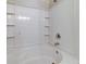 Clean white tiled bathtub with chrome fixtures and built-in shelving at 546 Tayrn Dr, Charleston, SC 29492