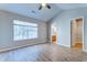 Vaulted ceiling bedroom has natural light from large window, adjoining bathroom, and closet at 546 Tayrn Dr, Charleston, SC 29492