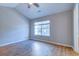 Neutral bedroom boasts vaulted ceiling, fan, and hardwood-style floors at 546 Tayrn Dr, Charleston, SC 29492