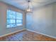 Cozy dining area featuring a modern chandelier and large window, perfect for enjoying meals at 546 Tayrn Dr, Charleston, SC 29492