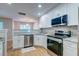 Open kitchen featuring granite countertops, modern stainless steel appliances and white cabinets at 546 Tayrn Dr, Charleston, SC 29492