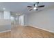 Spacious living room with a ceiling fan and beautiful laminate flooring throughout the main level at 546 Tayrn Dr, Charleston, SC 29492