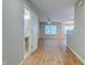 A spacious living room features stylish wood flooring, a fan and lots of natural light from a large window at 546 Tayrn Dr, Charleston, SC 29492