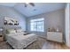 Bedroom with large window, wood-look floors, Queen bed, bedside tables and closet at 546 Tayrn Dr, Charleston, SC 29492