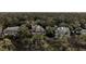 An aerial view of a residential community with mature trees and landscaping at 57 Goldenrod Ct, Kiawah Island, SC 29455