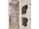 Modern bathroom with a glass shower, decorative tiling and chrome towel racks at 57 Goldenrod Ct, Kiawah Island, SC 29455