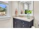 Bathroom featuring a sink, white framed mirror, and natural light from the window at 57 Goldenrod Ct, Kiawah Island, SC 29455