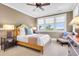Comfortable bedroom featuring a ceiling fan, natural light, and neutral earth tones at 57 Goldenrod Ct, Kiawah Island, SC 29455