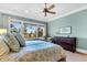 Spacious bedroom with large window views, hardwood floors, and light blue color scheme at 57 Goldenrod Ct, Kiawah Island, SC 29455