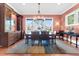 Dining room with a large table, natural light from windows with outside views, and a decorative chandelier at 57 Goldenrod Ct, Kiawah Island, SC 29455