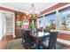Well-lit dining room featuring wooden floors, decorative chandelier, and outside views at 57 Goldenrod Ct, Kiawah Island, SC 29455