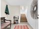 Inviting entryway with seating, shoe rack, staircase and decorative elements at 57 Goldenrod Ct, Kiawah Island, SC 29455