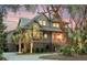 Stately home featuring lush landscaping, a circular driveway, and a welcoming entrance at 57 Goldenrod Ct, Kiawah Island, SC 29455