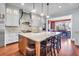 Beautiful kitchen featuring a central island with barstool seating, stainless appliances, and ample counter space at 57 Goldenrod Ct, Kiawah Island, SC 29455