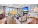 Cozy living room featuring a fireplace, natural light, and comfortable seating for relaxing and entertaining guests at 57 Goldenrod Ct, Kiawah Island, SC 29455