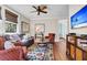 Comfortable living room featuring a plush sofa, ceiling fan and a vibrant area rug at 57 Goldenrod Ct, Kiawah Island, SC 29455