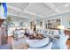Spacious living room showcasing an open layout, stylish furniture, and coffered ceilings for modern elegance at 57 Goldenrod Ct, Kiawah Island, SC 29455