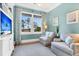 Comfortable living room with two sofas, a TV, and a large window with views at 57 Goldenrod Ct, Kiawah Island, SC 29455