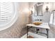 Stylish powder room featuring designer wallpaper, unique sink and modern lighting at 57 Goldenrod Ct, Kiawah Island, SC 29455