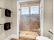 Contemporary shower with glass door, tile surround, and built-in bench seating at 57 Goldenrod Ct, Kiawah Island, SC 29455