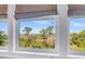Picturesque view from the window showcasing a tranquil marsh landscape and blue sky at 57 Goldenrod Ct, Kiawah Island, SC 29455