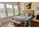 Bright bedroom with a large window, king-size bed, and tasteful decor at 5911 Steward St # 7, Hanahan, SC 29410