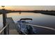 A boat is docked along side a quiet, tranquil waterfront with a view of the horizon at 5911 Steward St # 7, Hanahan, SC 29410