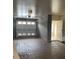 Spacious garage with brick floor and access door to the interior of the house at 5911 Steward St # 7, Hanahan, SC 29410