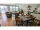 Inviting living room with hardwood floors, neutral furniture, and large windows at 5911 Steward St # 7, Hanahan, SC 29410