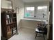 Cozy sitting room with large windows and built in bookshelf, offering a peaceful retreat at 5911 Steward St # 7, Hanahan, SC 29410