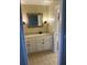 Bathroom features a vanity with granite countertop, white cabinets, and decorative mirror at 604 Ventura Pl, Mount Pleasant, SC 29464