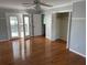 Bedroom with hardwood floors, closet with folding doors, and access to an outdoor balcony at 604 Ventura Pl, Mount Pleasant, SC 29464