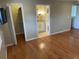 Bedroom with hardwood floors, an ensuite bathroom, and a walk in closet at 604 Ventura Pl, Mount Pleasant, SC 29464