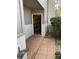 Exterior entrance with tile pathway, showing an open storage area and air conditioning unit at 604 Ventura Pl, Mount Pleasant, SC 29464