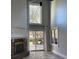 Living room with fireplace, high ceiling, large windows and backyard views at 604 Ventura Pl, Mount Pleasant, SC 29464