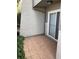 Exterior patio area with tile flooring and a sliding glass door, enhanced by green plants at 604 Ventura Pl, Mount Pleasant, SC 29464
