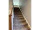 Carpeted staircase leading to the upper level of the home, painted in a neutral gray tone at 604 Ventura Pl, Mount Pleasant, SC 29464