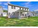 Wide backyard with lush green grass and covered patio at 5206 Cottage Lndg Dr, Summerville, SC 29485