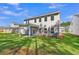 Spacious backyard with lush green grass and covered patio at 5206 Cottage Lndg Dr, Summerville, SC 29485