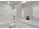 Bright bathroom with white cabinets, quartz countertop, and tub with shower combo at 5206 Cottage Lndg Dr, Summerville, SC 29485